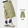Pantalones cargo de algodón puro para niño Duoduo 2026 nuevos shorts casuales estilo capri de verano para niños mayores