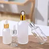 Botella de aceite de esencia transparente vidrio esmerilado líquido de esencia botella para rellenar botella con gotero de cabeza de goma muestra cosmética botella vacía venta al por mayor