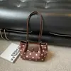 Bolso tote de lunares de nicho estilo coreano para mujer, nuevo modelo principios de otoño 2026, adecuado para el trabajo y los desplazamientos, bolso cruzado y de hombro casual único
