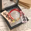Pulseira de Corda Tecida à Mão com Pingente de Donut Imitação de Jade Hetian Marca Fu Ano do Buming Pulseira de Casal para Mulheres