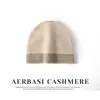 Venta al por mayor de fábrica Cachemira Transfronterizo Otoño e Invierno Nuevo Bloque de Color Engrosado Dobladillo Enrollado Giro Espalda Protección Auditiva Cálida Gorro de Punto para la Cabeza