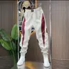 Calça Cropped Slim-Fit de Marca da Moda Primavera e Outono Novas Calças Masculinas Patchwork Vermelhas Casuais Calças Jogger Harem