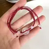 Pulseira Tecida de Calcedônia com Fivela Ping An Design de Nicho de Luxo Leve Sensação de Alto Padrão Cordão de Mão para Casal Joia de Mão Corda Vermelha do Ano de Nascimento