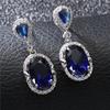 Moda Europea y Americana OL Azul Lago Forma de Huevo Zarcillos de Circonita Brillante Diamante Completo Chapado en Platino Mezcla y Combina Garra de Aire con Colgante de Borla