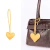 Colgante de Bolsa Casual de Cuero PU Corazón de Melocotón Corazón Relleno de Algodón Cuero Regalo de Pareja Colgante de Llavero Fábrica Venta al por Mayor