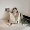 2026 Nuevo Estilo Artístico Simple Dibujos Animados Bordado Bolso de Hombro Único para Niñas Estudiante Fiesta Compras Tutoría Bolso Tote para Viajar