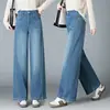 Jeans vintage azul lavado de cintura alta e perna reta para mulheres com costura lateral, caimento solto, efeito emagrecedor, alonga as pernas, design de perna larga estreita