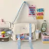 Linda Bolsa Cruzada Estilo Universitario para Chica, Estilo Ins Japonés, Bolso Mensajero Versátil de Gran Capacidad para Estudiantes, Bolso Modelo Nuevo 2026