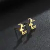 Pendientes Personalizados de Nuevo Estilo Transfronterizos Símbolo Europeo y Americano Joyería de Acero Inoxidable Pendientes Chapados Pendientes de Mujer Accesorios de Joyería Venta al por Mayor