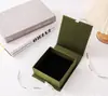 Caja de joyería abatible con cinta caja de libro para anillos collares pulseras embalaje de esponja caja de cartón venta al por mayor