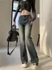 Jeans de campana de tiro bajo retro americano para mujer, dobladillo crudo desgastado, corte ajustado, favorecedores, pantalones de campana de moda hasta el suelo