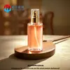 Venta directa de fábrica botella dispensadora de vidrio para loción transparente de 100 ml a 120 ml, botella dispensadora de vidrio para suero para el cuidado de la piel