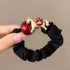 Goma para el pelo con bloques de color negro y rojo, con caballito dorado y símbolos de la suerte para el Año del Caballo, adecuada para coletas altas y accesorios para el cabello
