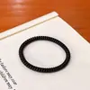 Goma para el pelo fina negra tipo cable de teléfono para mujer, sin costuras, alta elasticidad, banda para el pelo de color liso simple, modelo nuevo y elegante