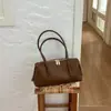 Bolso de mano retro europeo y americano Shuai Mi Jia para mujer, nuevo bolso de hombro minimalista estilo 2026 para el día a día, bolso de lujo ligero para el antebrazo