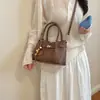 Bolso Cubo Casual de Moda Transfronterizo Nuevo Estilo Otoño/Invierno 2026 Bolso de Hombro Único con Textura Retro Bolso de Mano Personalidad