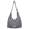 Bolsa rayada de gran capacidad transfronteriza para mujer, nueva bolsa de lona tote de estilo coreano de moda para verano 2026, bolso de hombro para el trabajo