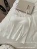 Camiseta sin mangas acanalada suave de seda helada sin costuras con copas fijas y tirantes finos, copa de una sola pieza, hace que el pecho parezca más pequeño, se puede usar como prenda exterior, hermosa espalda con tirantes finos
