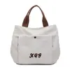Bolsa de Lona com Letra Bordada para Mulheres Modelo 2025 Bolsa para Trabalho, Deslocamento, Almoço Bolsa de Mão Versátil Bolsa Tote Casual para Mulheres