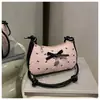 Bolsa de Braço Rosa com Laço em Forma de Meia-Lua para Mulheres Verão 2025 Nova Moda Textura Versátil Luxo Leve Bolsa Quadrada Pequena de Ombro