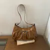 Bolsa de ombro feminina casual e moderna, nova coleção outono 2026, apresentando um design único, estilo minimalista e bolsa de axila fashion