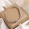 Pulsera de Acero de Titanio Forma de C Abierta Sin Desvanecimiento Moda Retro Europea y Americana Galvanizada 18K Pulsera Al por Mayor