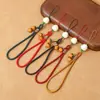 Nuevo Estilo Colgante para Teléfono Móvil Ruyi de Caqui Correa Corta para Muñeca Hombres y Mujeres Llavero con Colgante de Caqui de Vidrio Placa Antiperdida