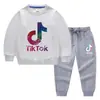 Conjunto de Ropa Infantil Transfronterizo Nuevo Primavera y Otoño 2026: Conjunto de Dos Piezas de Sudadera y Pantalón Largo para Niños, Atuendo de Algodón de Manga Larga para Bebé de Exportación