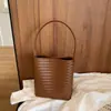 Bolso cubo tejido de estilo coreano transfronterizo para mujer, bolso texturizado, bolso de hombro simple para el día a día de verano 2026 con bolsillo interior