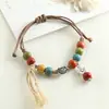 Pulseira de cerâmica com contas, pulseira tecida artesanalmente de nicho, estilo étnico colorido, joia artística versátil, ajustável e não desbota