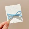 Pinza para el pelo azul de lunares con lazo estilo coreano para mujer, nuevo modelo 2026, pinza lateral para flequillo y mechones, accesorio para el cabello