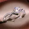 Anillo de Compromiso Nueve Nuo Deseo Nuevo Imitación Moissanita Transfronterizo Europa y Estados Unidos Infinito Hueco Seis Garras Propuesta Anillo de Diamante