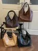 Bolso de axila tejido de PU de alta gama para mujer, nuevo bolso de axila de moda para otoño/invierno 2026, bolso tote para ir al trabajo