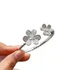 Pulsera de Borde de Perlas de Diamante Incrustado con Doble Flor de Venta Caliente Transfronteriza Europea y Americana Trébol Flor de Seis Pétalos Apertura Pulsera de Nicho Pulsera