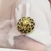 Botones estilo Chanel de gota de aceite con cabeza de león en relieve francés para cárdigans de punto y abrigos, botones metálicos de alta gama