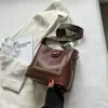 La popular bolsa de cubo de este año para mujer, nueva de otoño e invierno 2022, retro, versátil, bandolera, bolsa de hombro de alta calidad