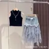 Conjunto de Verano para Niñas Estilo Coreano Moderno 2026 Nuevo Modelo Chaleco sin Mangas con Parches de Malla Conjunto de Falda de Mezclilla para Bebés