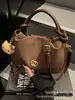 Bolsa Feminina 2025 Nova Moda Outono e Inverno High-End Retrô para o Dia a Dia Feminina Ombro Único Transversal Bolsa Bolinho