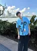 Camisa de Manga Curta Azul Estilo Férias Estampa Ilha Gola Cubana Estilo Preguiçoso Nicho Casual Verão para Homens e Mulheres