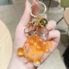 Explosivo Creativo Aceite Luminoso Tortuga Llavero Colgante para Bolso Máquina de Muñecos Caja Sorpresa Pequeño Regalo Colgante