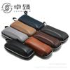 Fabricantes de estuches para gafas Estuche para gafas de sol de cuero PU con patrón de lichi Estuche para gafas de sol de EVA engrosado Transfronterizo Estuche para gafas de sol personalizable con logotipo