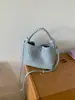 Bolsa de cesta feminina tecida à mão 2026 novo estilo primavera-verão bolsa de mão nicho de alta qualidade para o dia a dia bolsa de ombro tipo balde