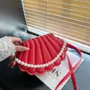 Bolsa de Concha Estilo Coreano de Nicho Nova Coleção Outono/Inverno 2026 Bolsa Feminina Moda Simples Bolsa de Ombro Casual para o Dia a Dia Bolsa Transversal
