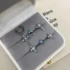 Nuevos y modernos aretes de cruz con diamantes completos Jiuhan para mujer, ear cuffs de acero de titanio de nicho, populares tachuelas de hueso de la oreja de alta gama