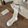 Tacto Súper Suave 2025 Otoño e Invierno Nuevos Calcetines de Lana Cálida de Color Sólido para Mujer Tipo JK Holgados de Tubo Largo Venta al por Mayor