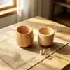 He Shi aislamiento del hogar taza de té de madera creativa madera maciza protección del medio ambiente taza de agua de vientre redondo taza de madera de primera clase venta al por mayor