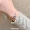 Pulsera Hueca Elegante y Fresca con Incrustaciones de Diamantes Azules para Mujer, Exquisita y de Alta Gama, Lujo Ligero, Diseño de Nicho, Pulsera que Ilumina la Piel