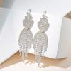 Oferta especial al por mayor aretes estilo coreano transfronterizos nuevos aretes largos de borla con pedrería foto callejera boda nupcial aretes exagerados