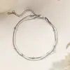 Tobillera de Acero de Titanio y Oro de 18 Quilates para Mujer, Cadena para el Pie de Nuevo Estilo Otoño/Primavera Transfronterizo, Lujo Ligero Nicho, Alta Gama para Chicas, No se Desvanece, Venta al por Mayor
