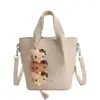 Bolso Cubo de Estilo Coreano de Nicho para Mujer Modelo Nuevo Primavera 2026 Bolso de Hombro Cruzado Elegante de Gama Alta